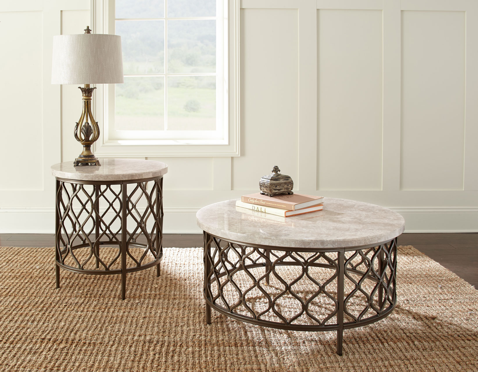 Roland marble-top occasional tables featuring a round cocktail table and matching end table with decorative metal lattice bases.