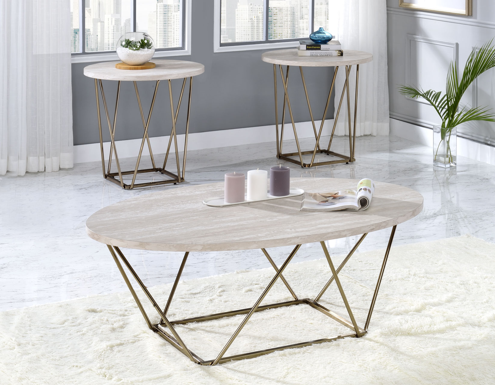 Rowyn 3-Piece Occasional Table Set featuring an oval cocktail table and two matching round end tables with faux-marble tops and gold metal bases.