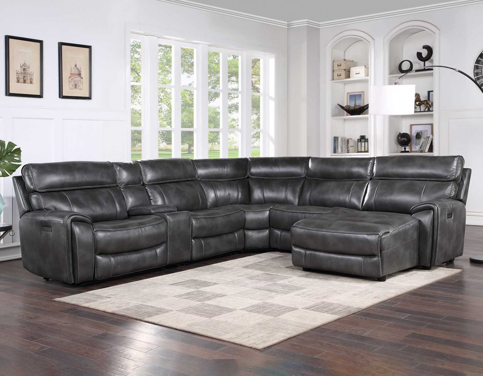 Dark gray dual-power reclining sectional with chaise lounge, premium leather upholstery, and modern modular seating for large living rooms.