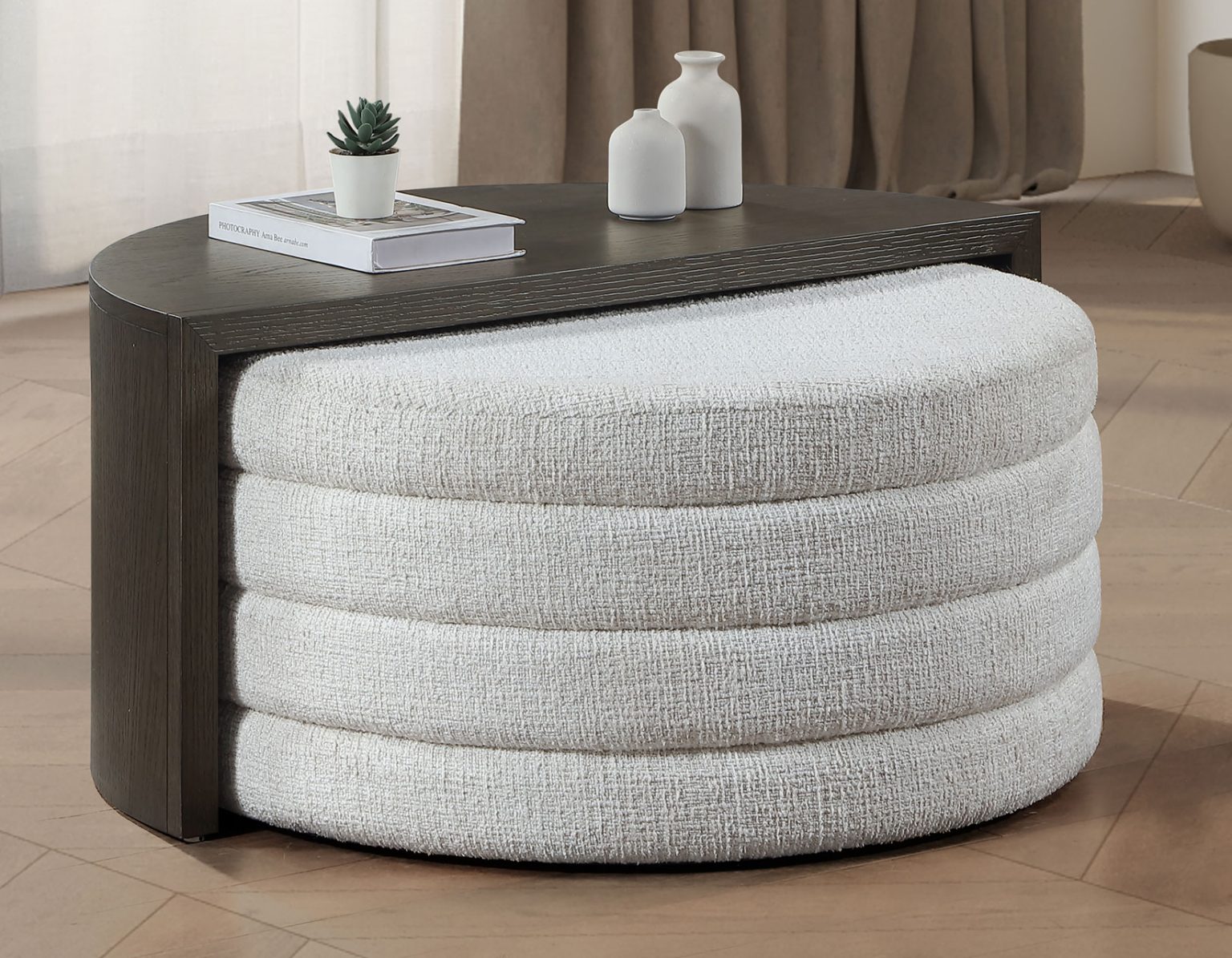 Florence black nesting cocktail table with upholstered ottoman, modern curved design, and space-saving functionality.