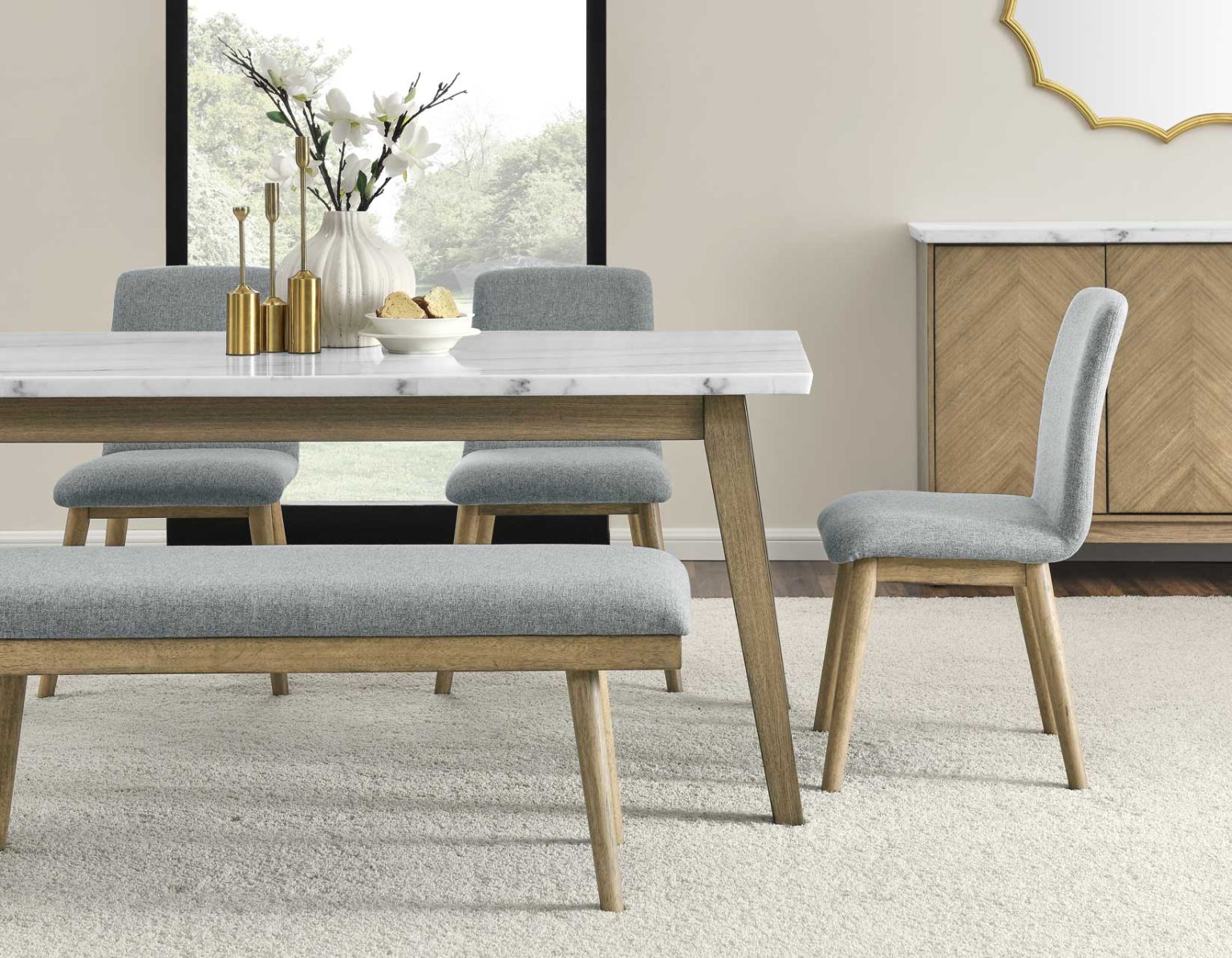 Vida 5-piece dining set featuring a white marble-look tabletop, upholstered gray chairs, and matching bench with natural wood finish.
